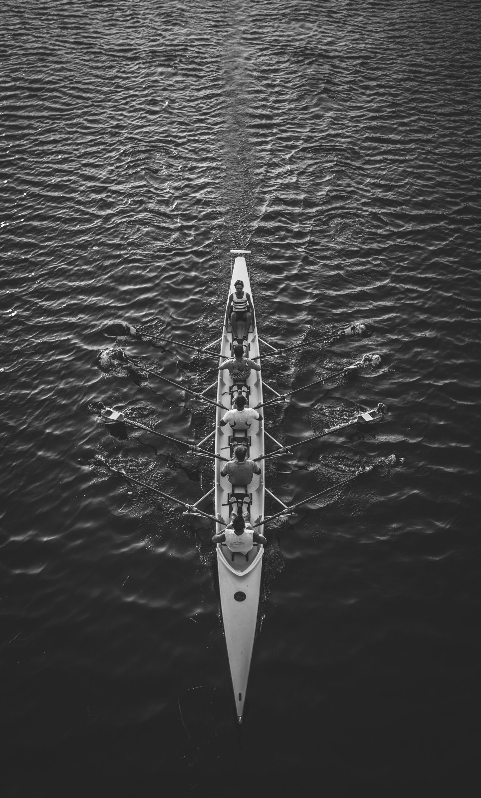 people riding boat on body of water